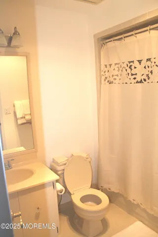 a bathroom with a toilet and a sink