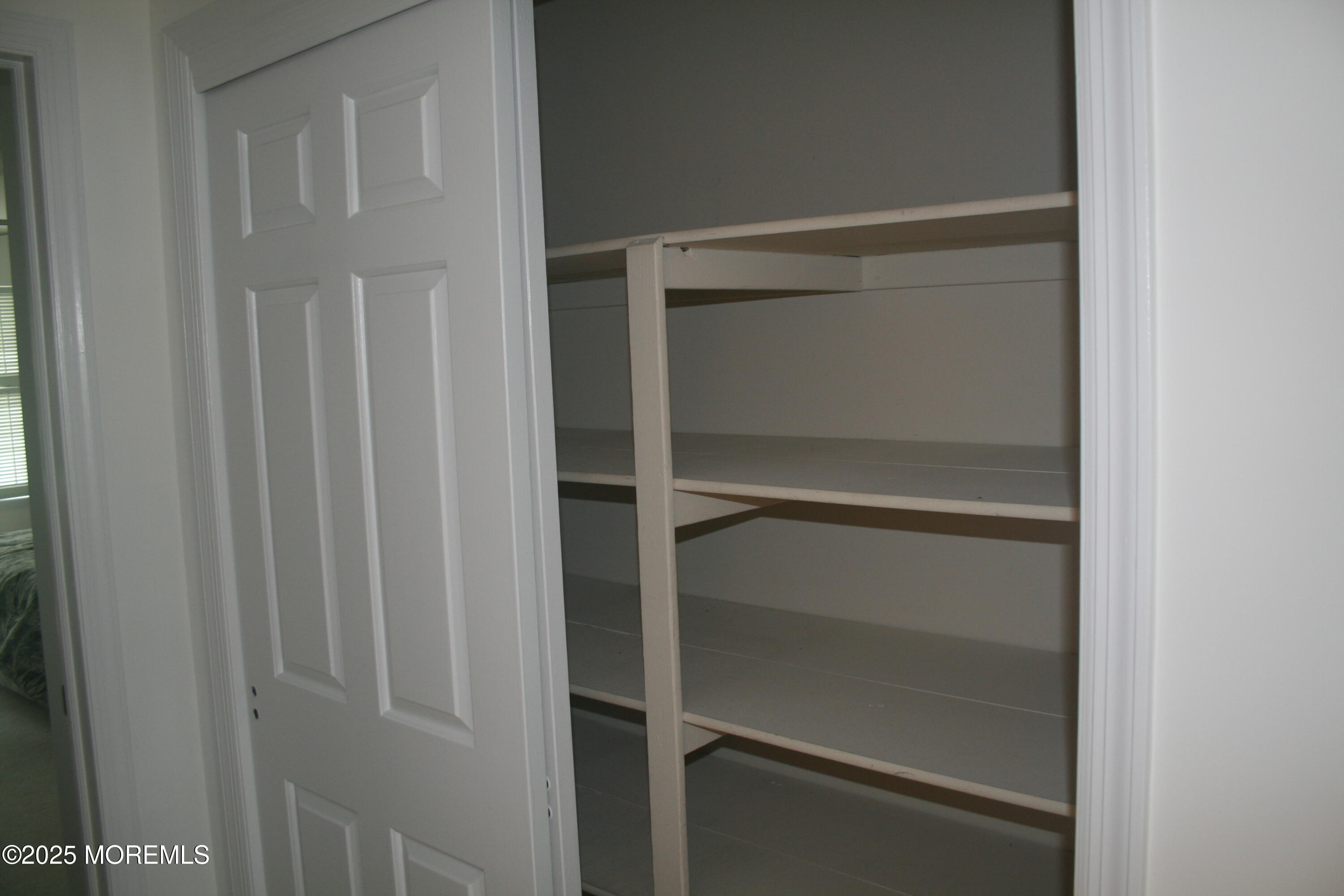 35 Apple Drive Spring Lake Heights, NJ 07762 - Photo 18 of 23 a view of walk in closet with empty racks