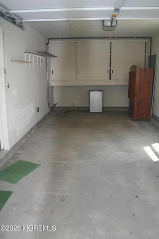 a view of storage and utility room with a cabinet