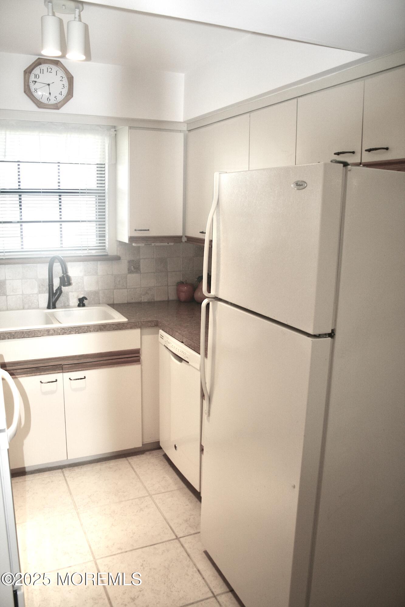 35 Apple Drive Spring Lake Heights, NJ 07762 - Photo 8 of 23 a kitchen with a refrigerator and a sink