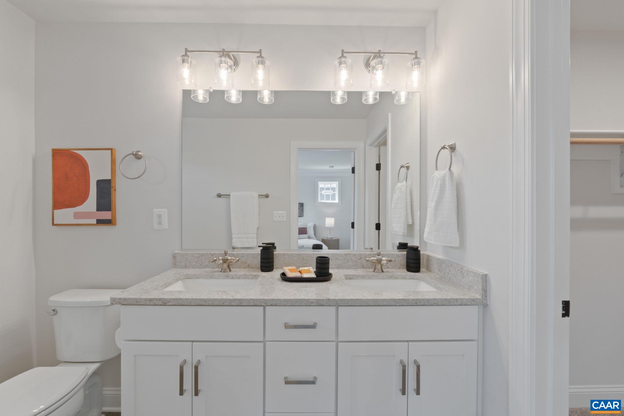 2215 Woodburn Road Charlottesville, VA 22901 - Photo 17 of 32 a bathroom with a sink double vanity and a mirror