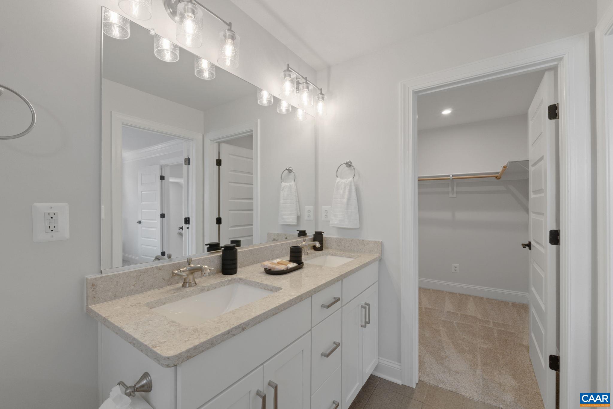 2215 Woodburn Road Charlottesville, VA 22901 - Photo 20 of 32 a bathroom with double sink and a mirror