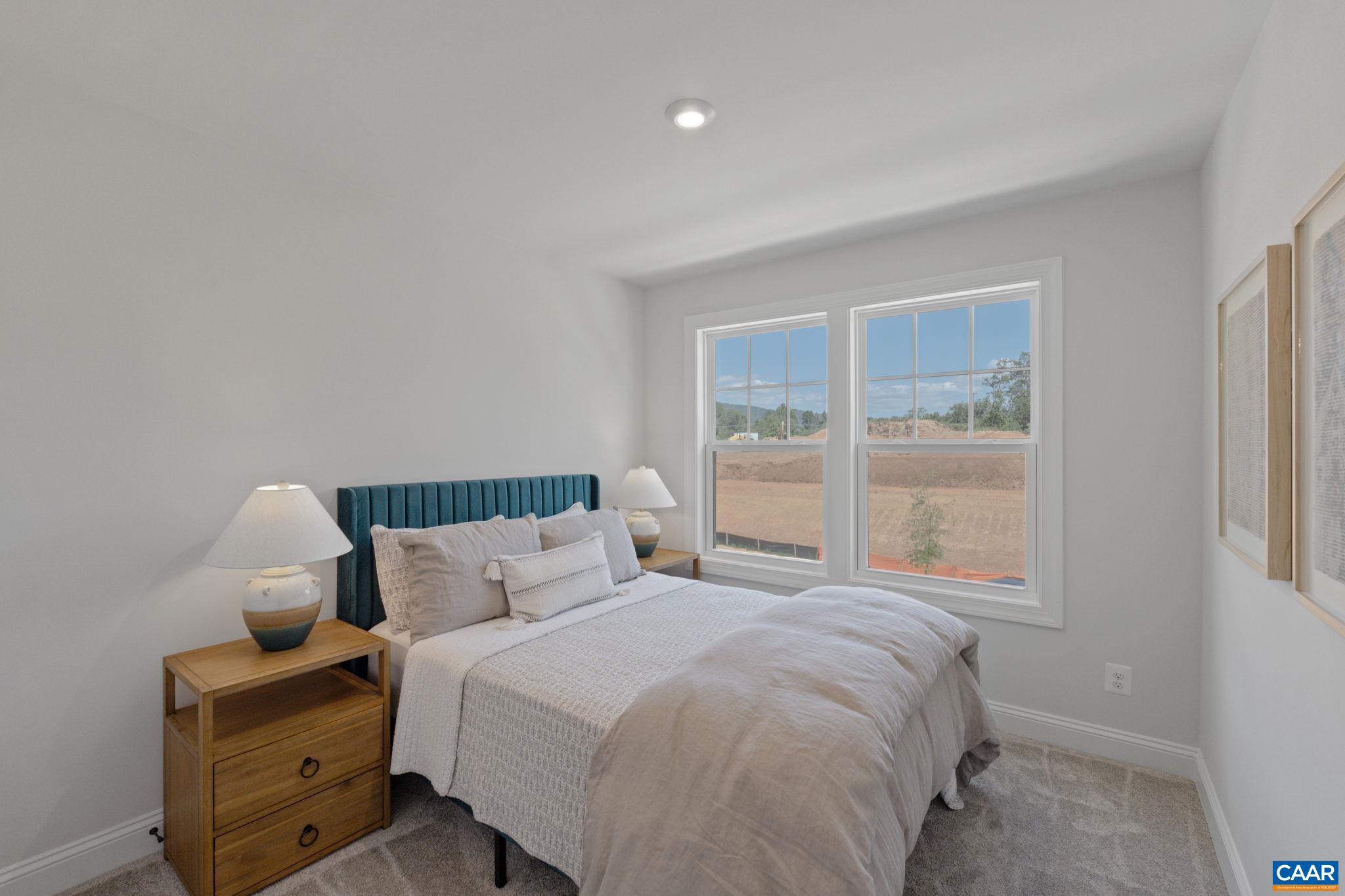 2215 Woodburn Road Charlottesville, VA 22901 - Photo 24 of 32 a bedroom with a bed and a window