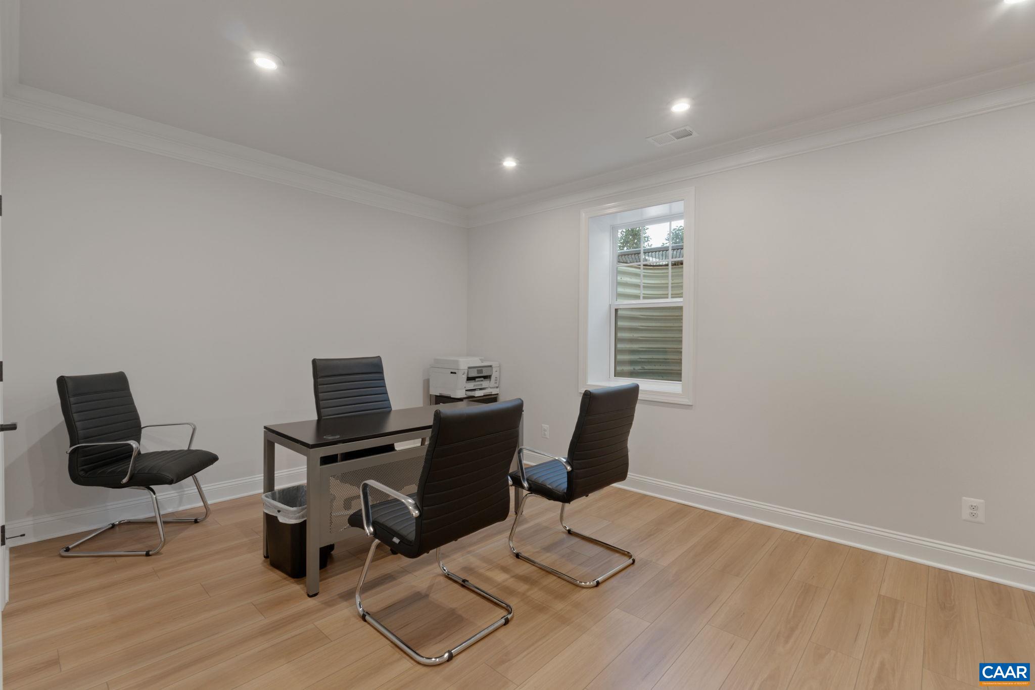 2215 Woodburn Road Charlottesville, VA 22901 - Photo 27 of 32 a view of workspace with chair and wooden floor