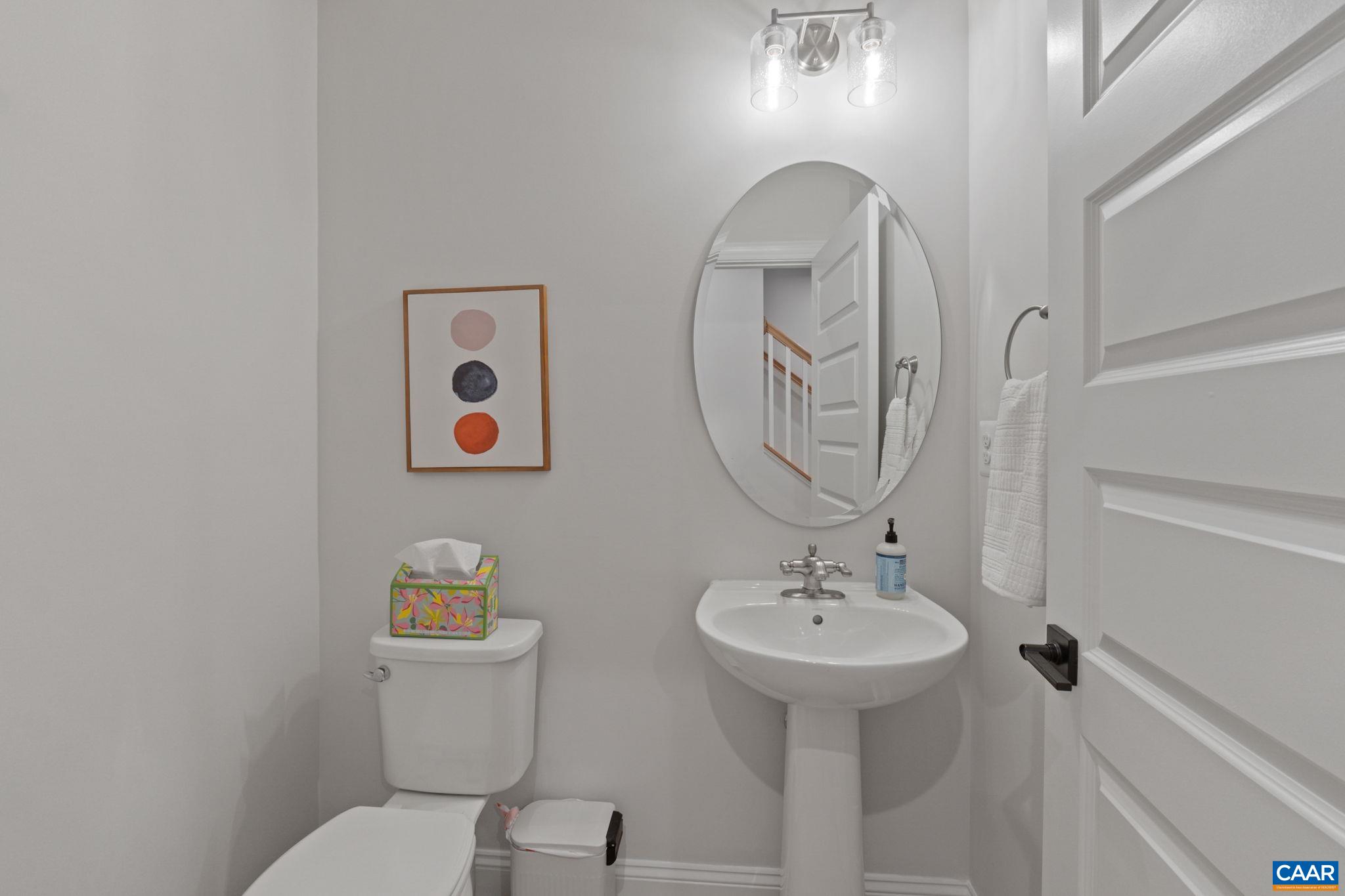 2215 Woodburn Road Charlottesville, VA 22901 - Photo 28 of 32 a bathroom with a toilet a sink and mirror