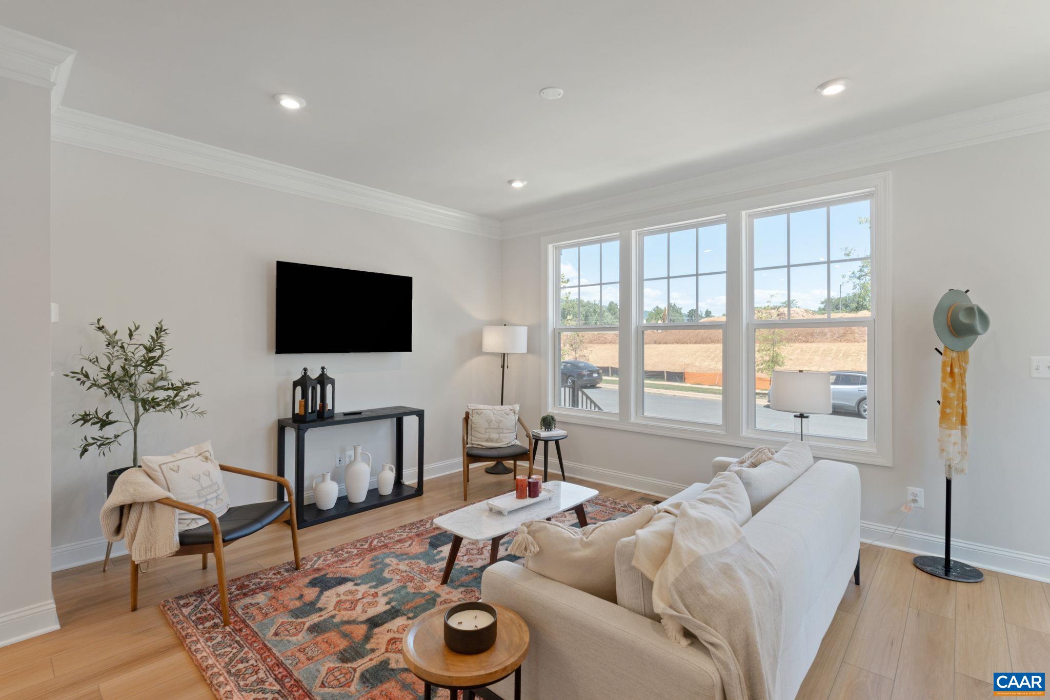 2215 Woodburn Road Charlottesville, VA 22901 - Photo 5 of 32 a living room with furniture and a flat screen tv