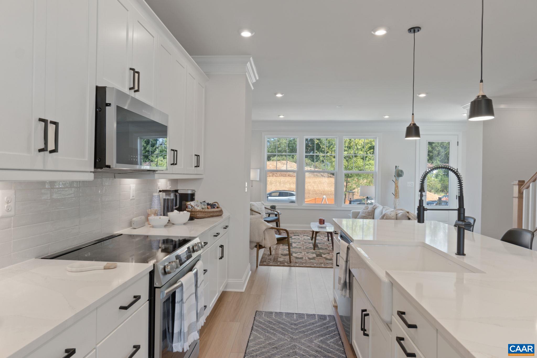 2215 Woodburn Road Charlottesville, VA 22901 - Photo 10 of 32 a open kitchen with stainless steel appliances granite countertop a sink stove and cabinets