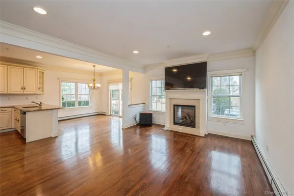 a living room with furniture fireplace and flat screen tv