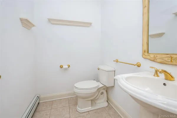 a white toilet sitting next to a bathroom sink