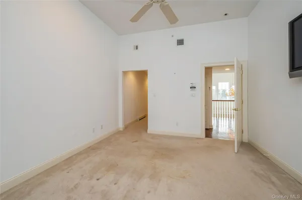 a view of hallway with wooden floor