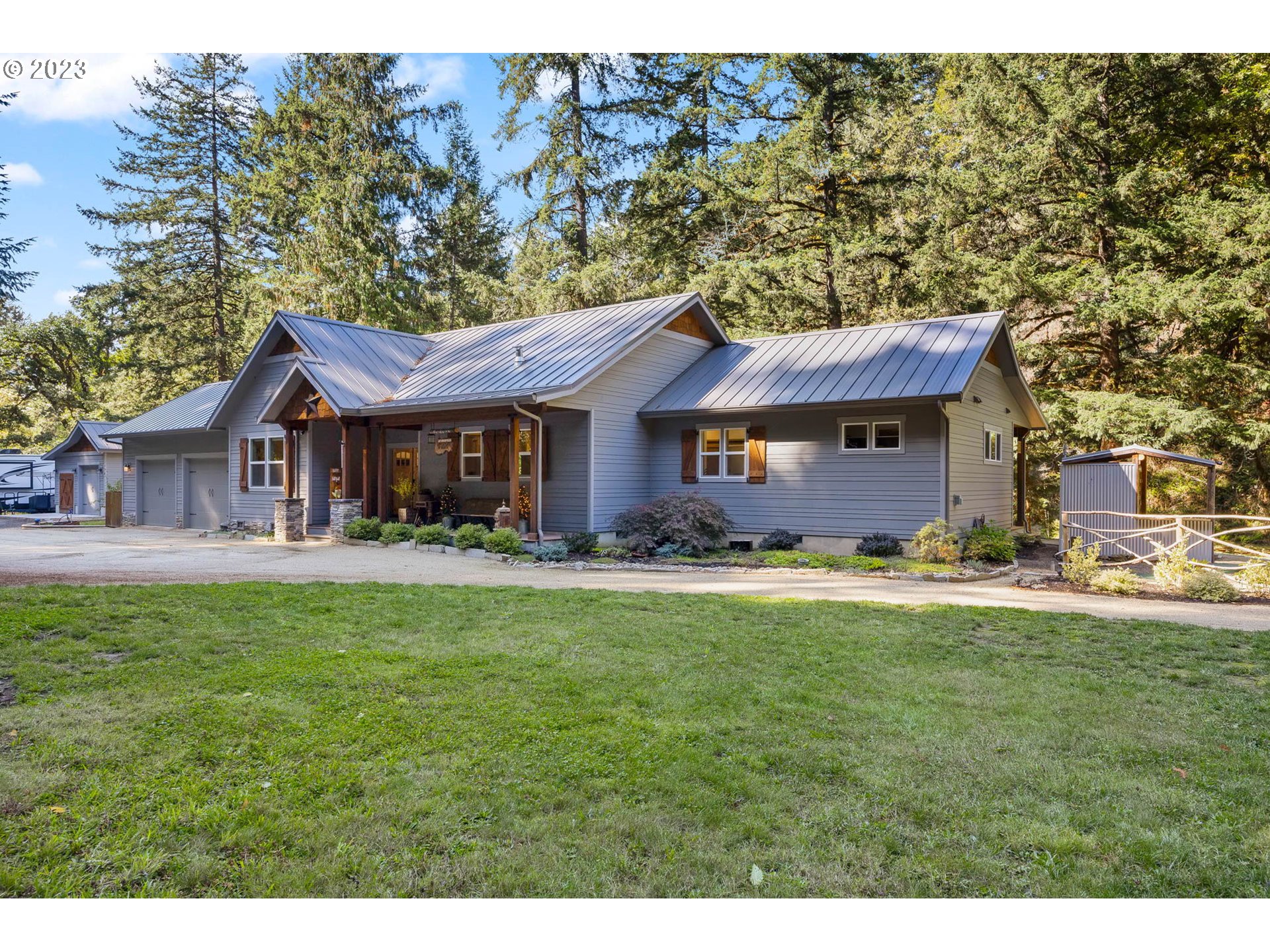 37693 Hills Creek Road Springfield, OR 97478 - Photo 3 of 48 a front view of a house with a garden