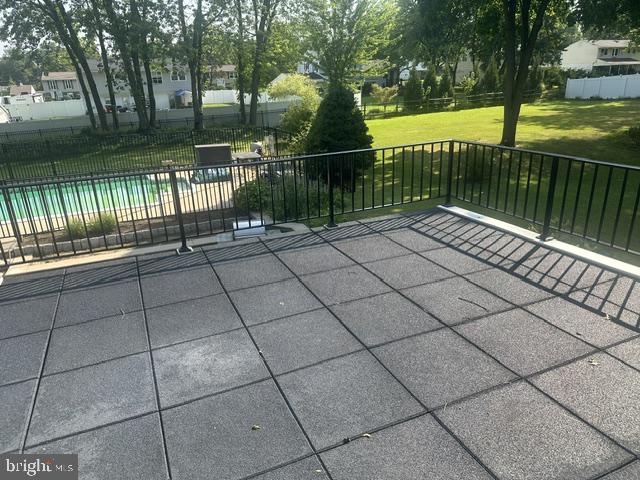 215 Hancock Road North Wales, PA 19454 - Photo 15 of 25 Sunny roof deck overlooking a serene pool.