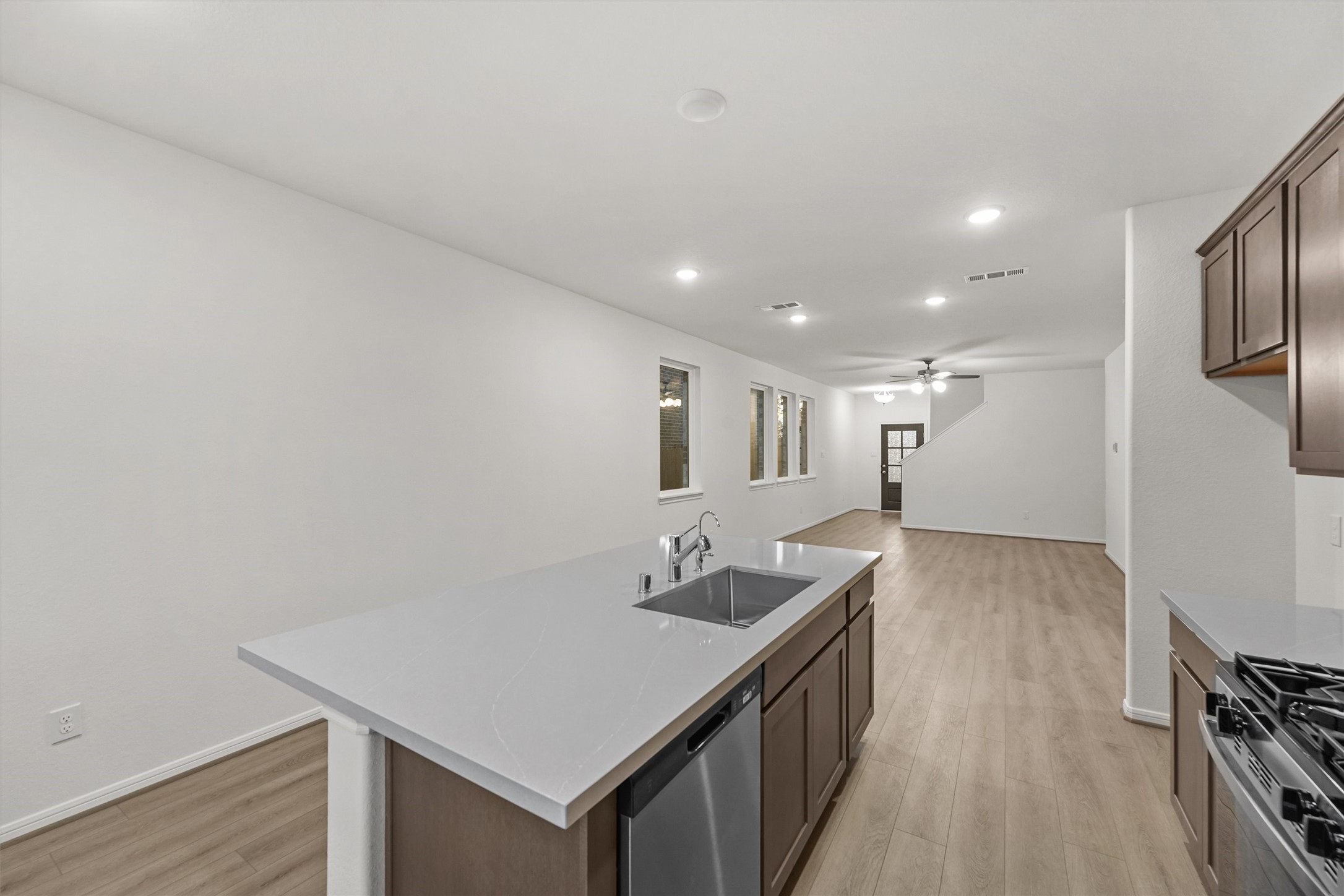 19111 Hazel Firs Court Magnolia, TX 77355 - Photo 12 of 34 a kitchen with granite countertop a sink and stove top oven