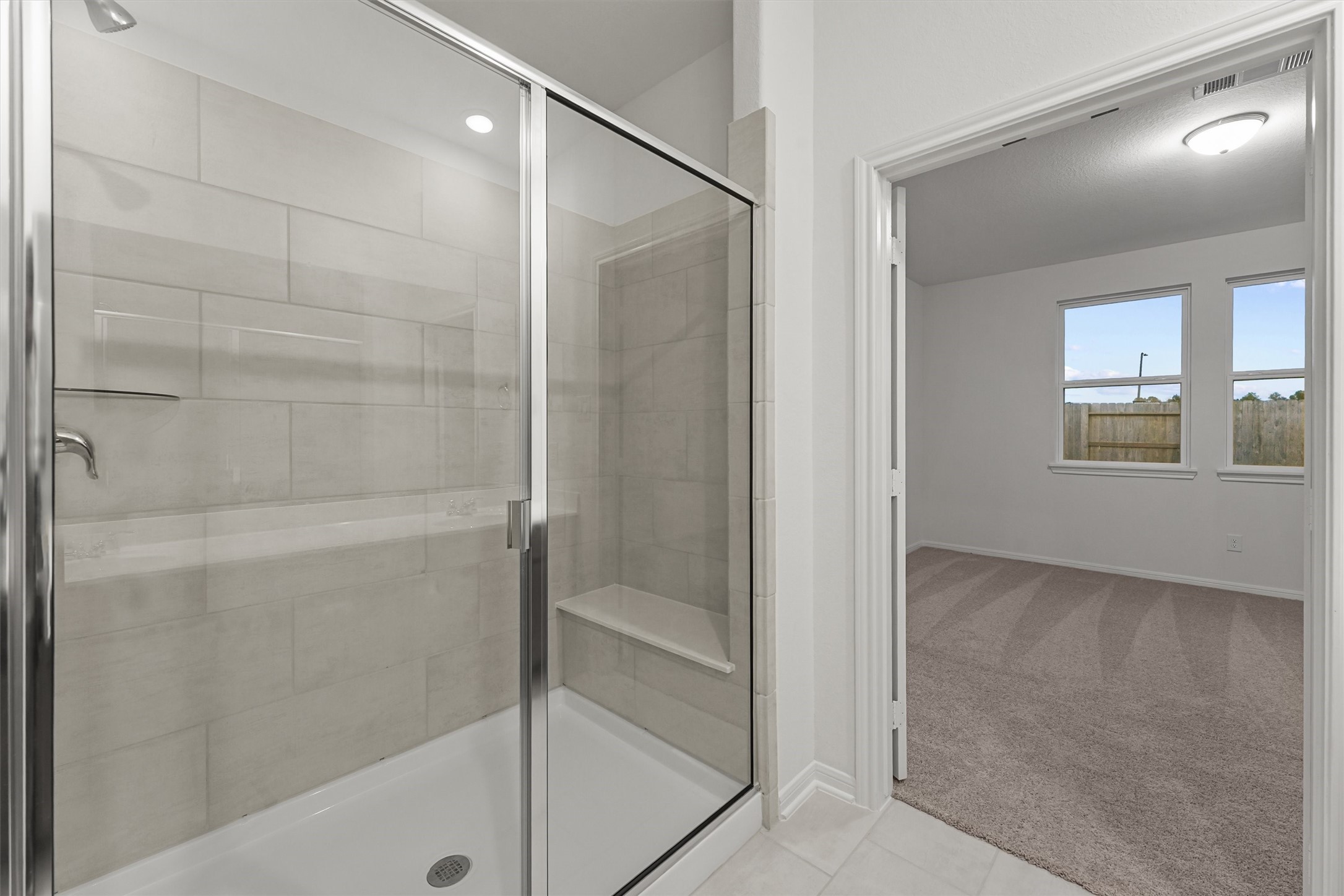 19111 Hazel Firs Court Magnolia, TX 77355 - Photo 16 of 34 a bathroom with a bathtub and shower