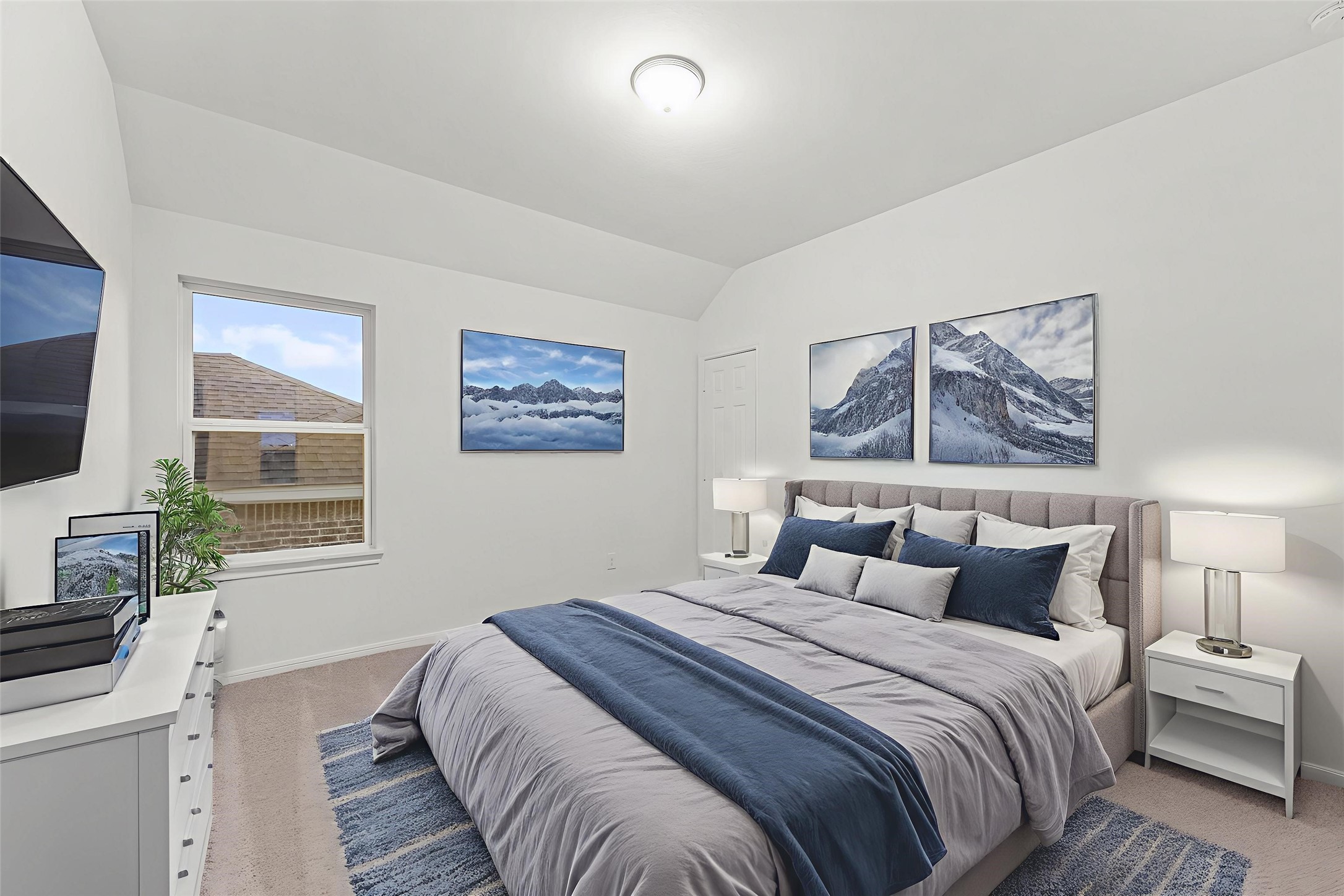 19111 Hazel Firs Court Magnolia, TX 77355 - Photo 25 of 34 a bedroom with a large bed and a flat screen tv