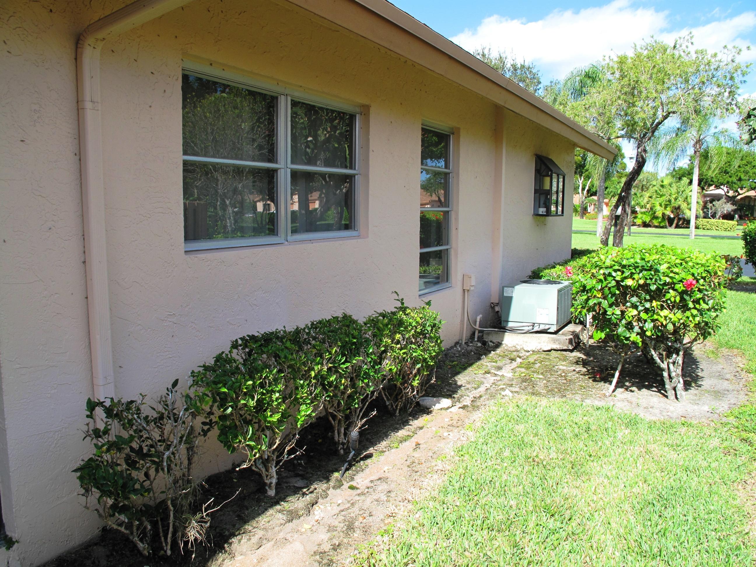 8152 Sweetbriar Way, Unit A Boca Raton, FL 33496 - Photo 34 of 44 Side view of villa (2)