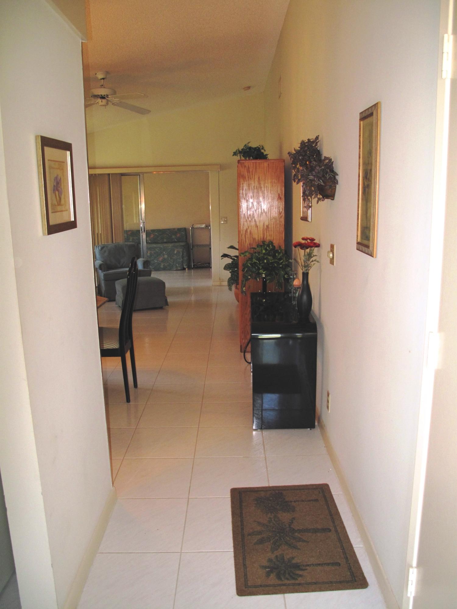 8152 Sweetbriar Way, Unit A Boca Raton, FL 33496 - Photo 9 of 44 Hallway into living area
