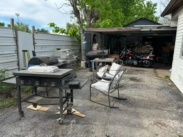 a view of backyard with seating space and furniture