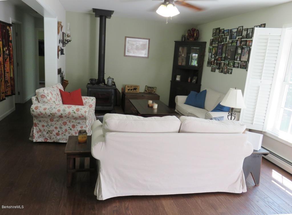 714 Dimmock Road Otis, MA 01253 - Photo 2 of 14 a living room with furniture and a couch