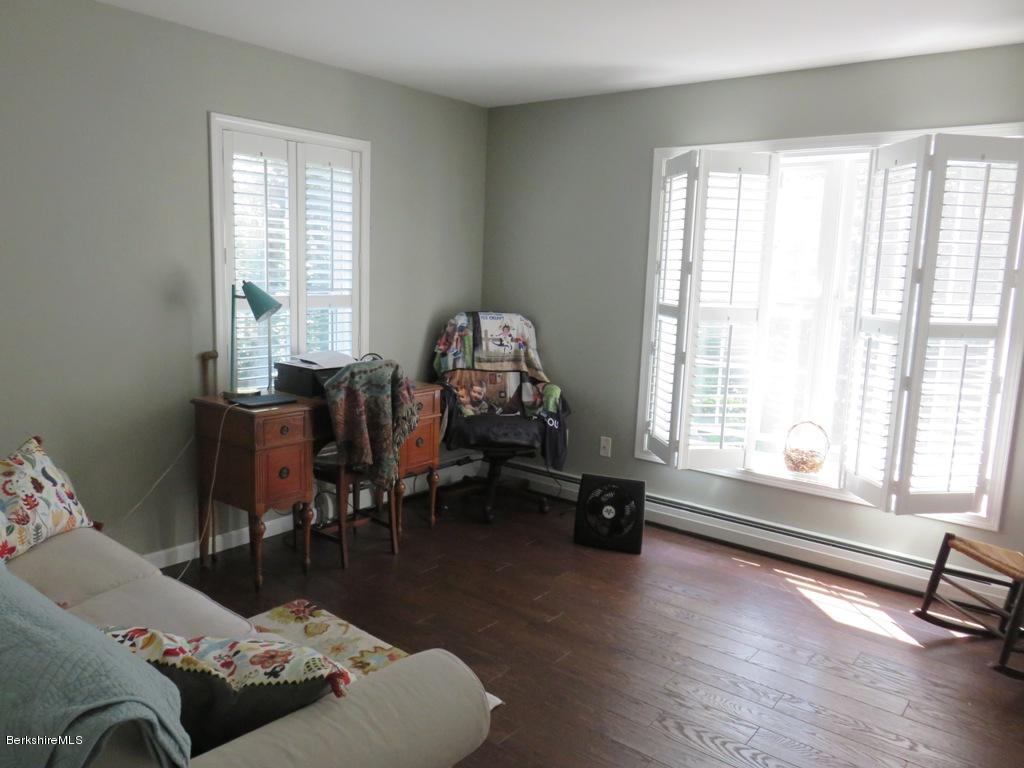 714 Dimmock Road Otis, MA 01253 - Photo 11 of 14 a living room with furniture and a wooden floor