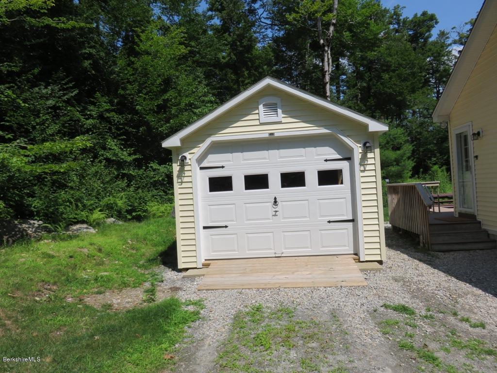 714 Dimmock Road Otis, MA 01253 - Photo 13 of 14 a front view of a house with a yard