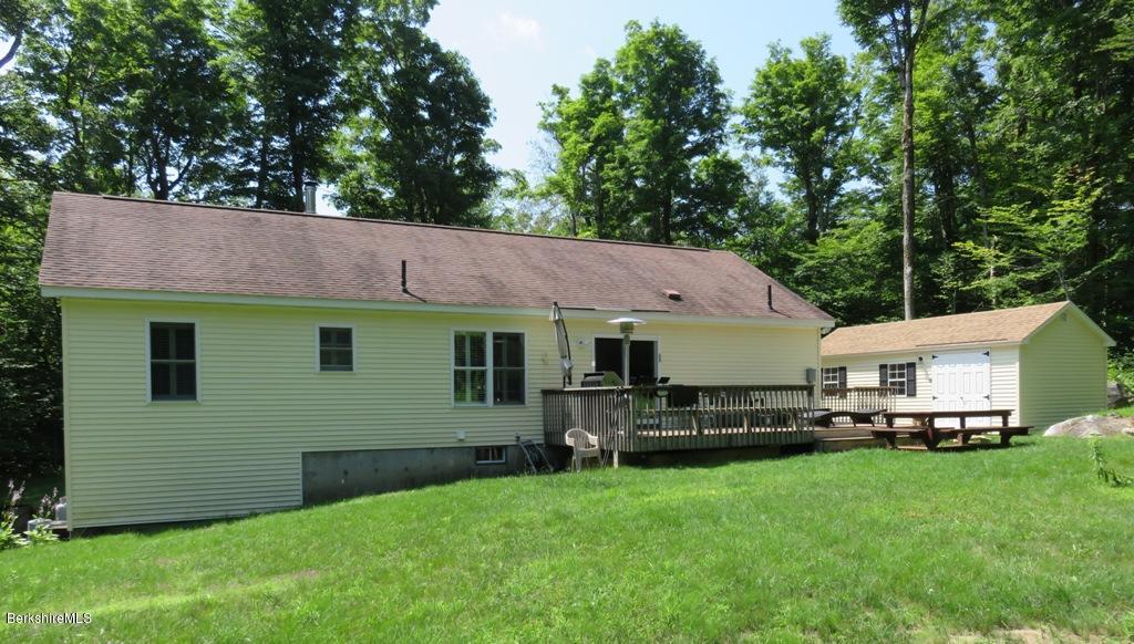 714 Dimmock Road Otis, MA 01253 - Photo 14 of 14 a view of a house with a yard plants and large tree