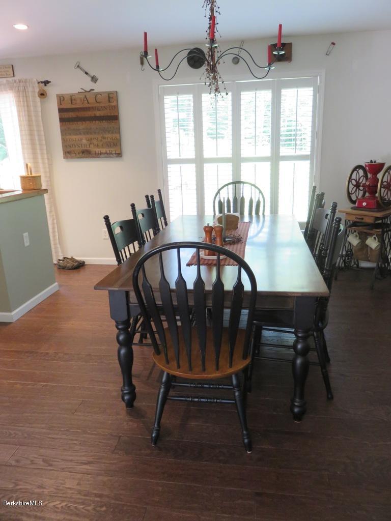 714 Dimmock Road Otis, MA 01253 - Photo 7 of 14 a view of a dining room with furniture window and outside view