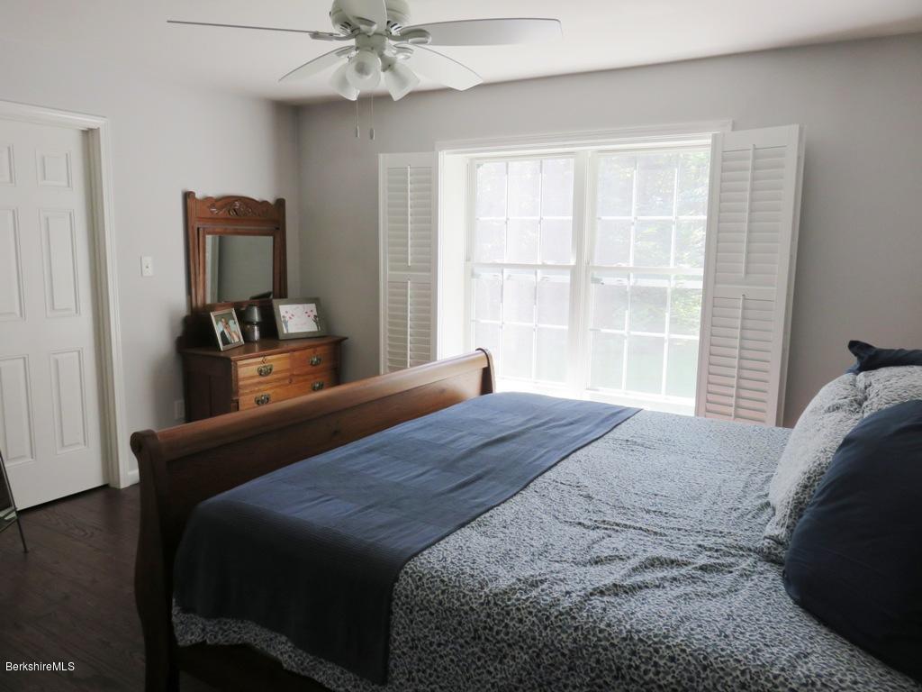 714 Dimmock Road Otis, MA 01253 - Photo 9 of 14 a bedroom with a bed and window