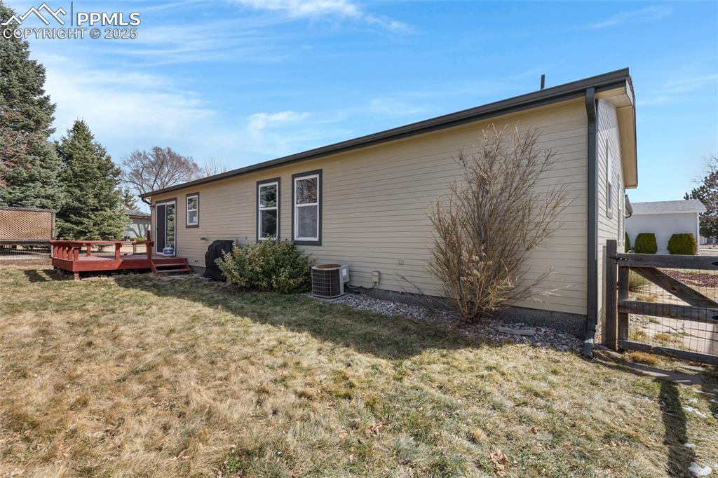 7659 Marmot Point Colorado Springs, CO 80922 - Photo 22 of 24 a view of a house with a patio