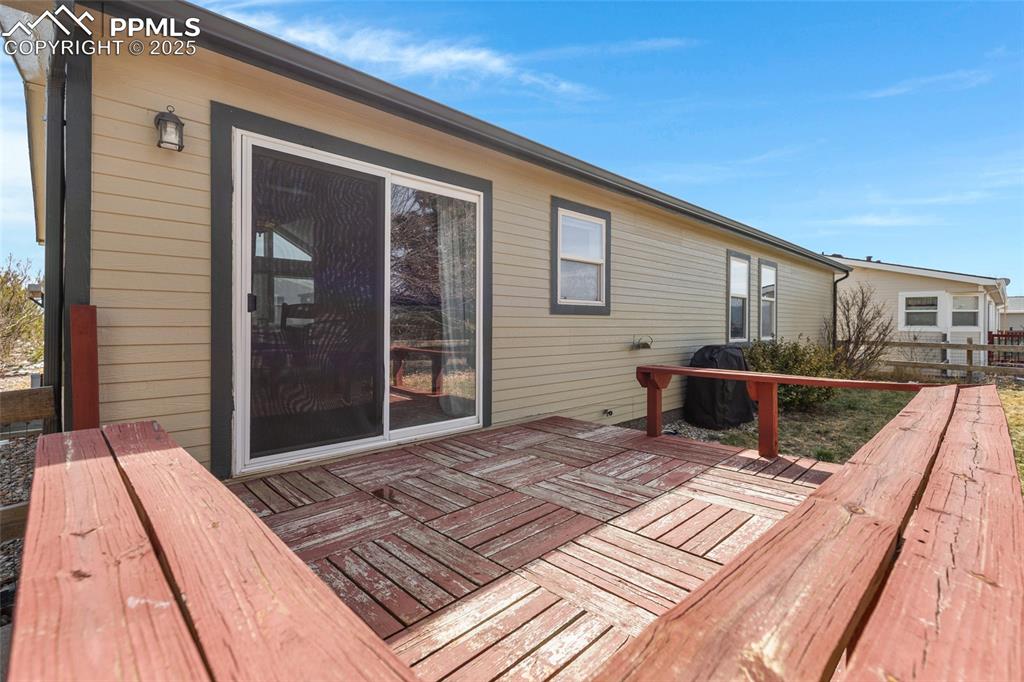 7659 Marmot Point Colorado Springs, CO 80922 - Photo 24 of 24 a view of a backyard with sitting area
