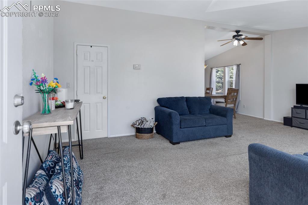 7659 Marmot Point Colorado Springs, CO 80922 - Photo 6 of 24 a living room with furniture and flowers
