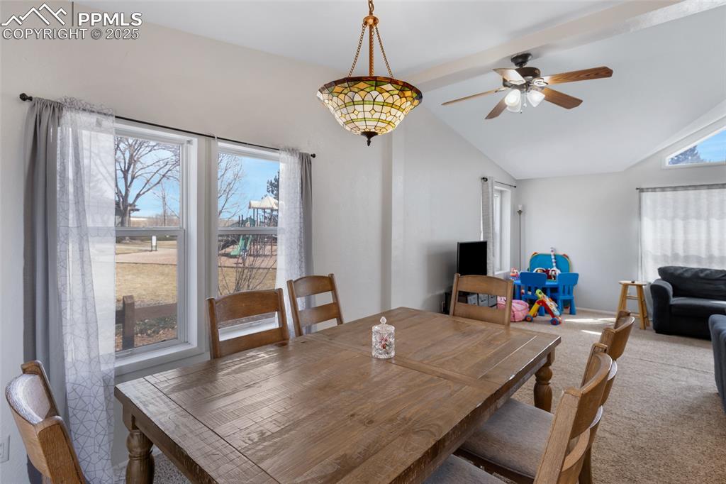 7659 Marmot Point Colorado Springs, CO 80922 - Photo 9 of 24 a view of a dining room with furniture window and wooden floor