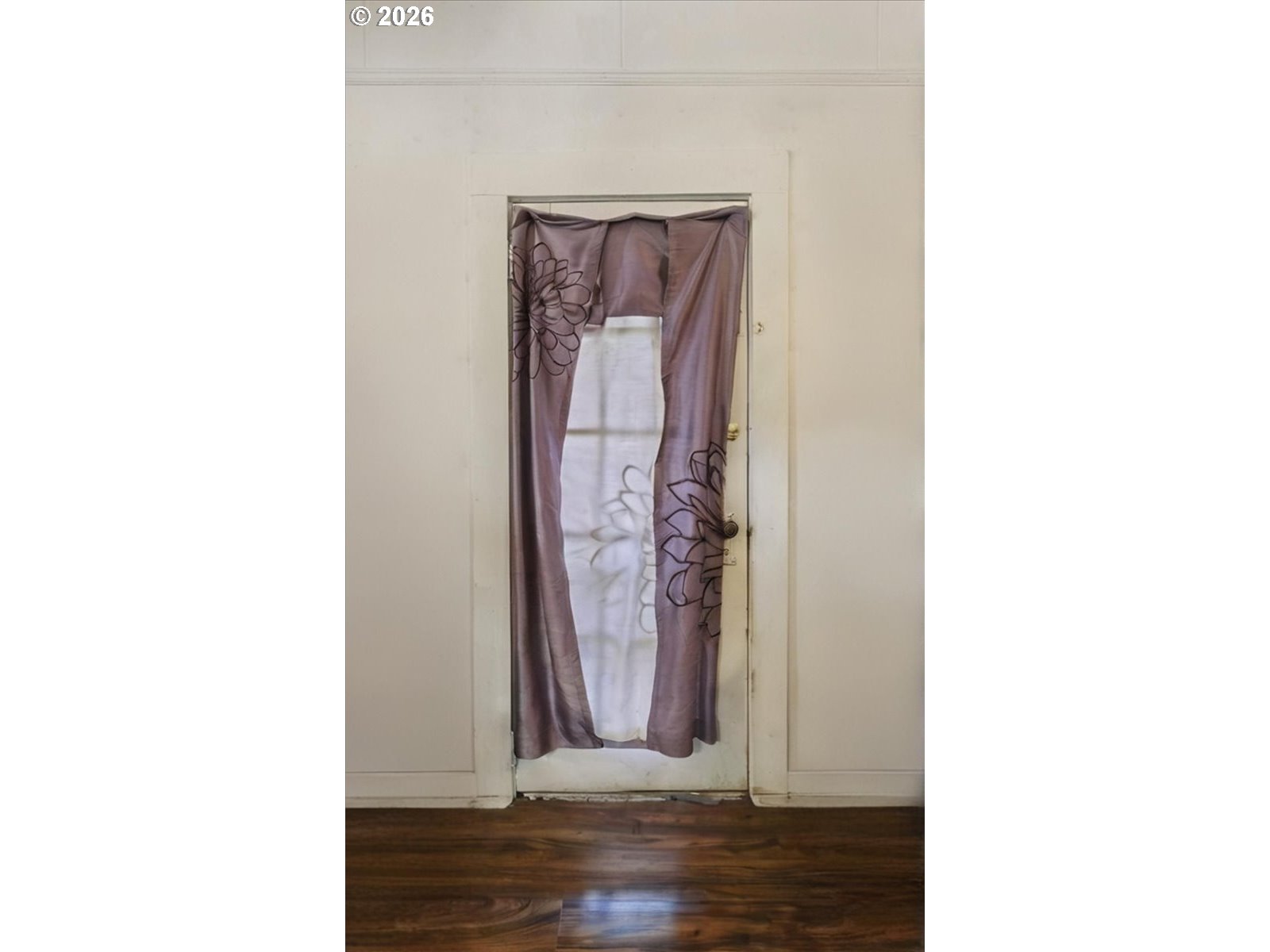 740 South 6th Street Cottage Grove, OR 97424 - Photo 5 of 21 a view of a room with door and wooden floor