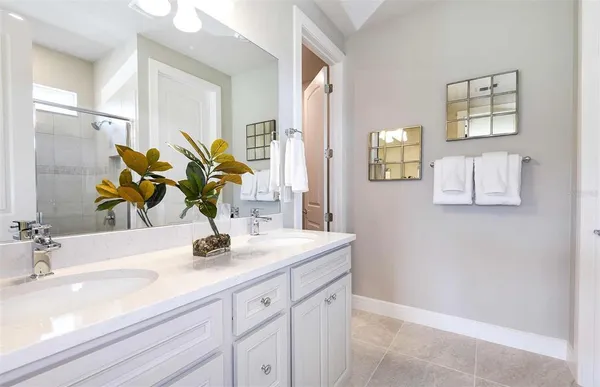 a bathroom with a sink a vanity and a mirror