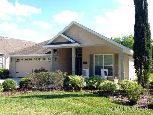 8219 Southwest 77th Avenue Gainesville, FL 32608 - Photo 1 of 1 a view of a house with a yard and potted plants