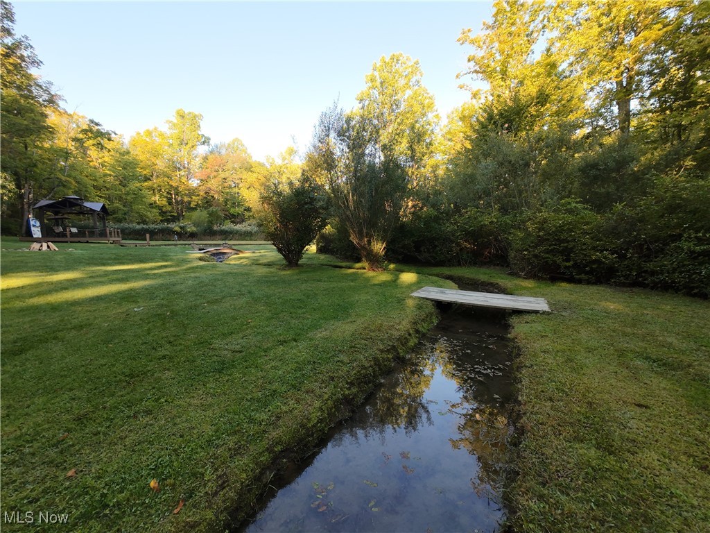5232 Emerson Road Madison, OH 44057 - Photo 35 of 48 View of grassy yard with a gazebo and a fire pit