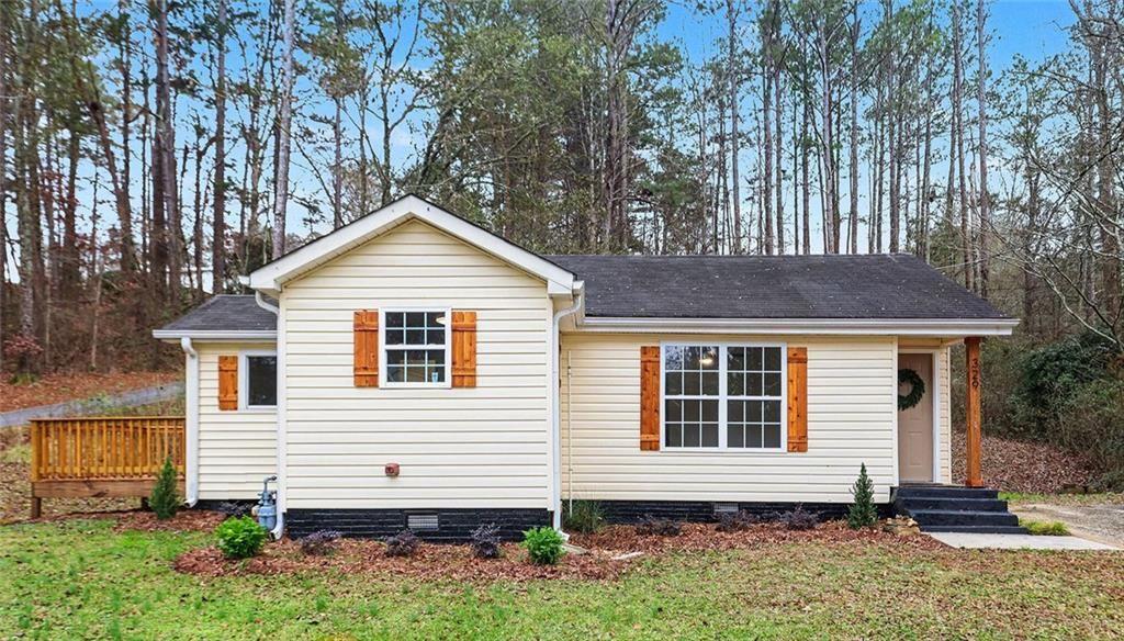 329 Old Acworth Road Dallas, GA 30132 - Photo 1 of 1 a front view of a house with a yard