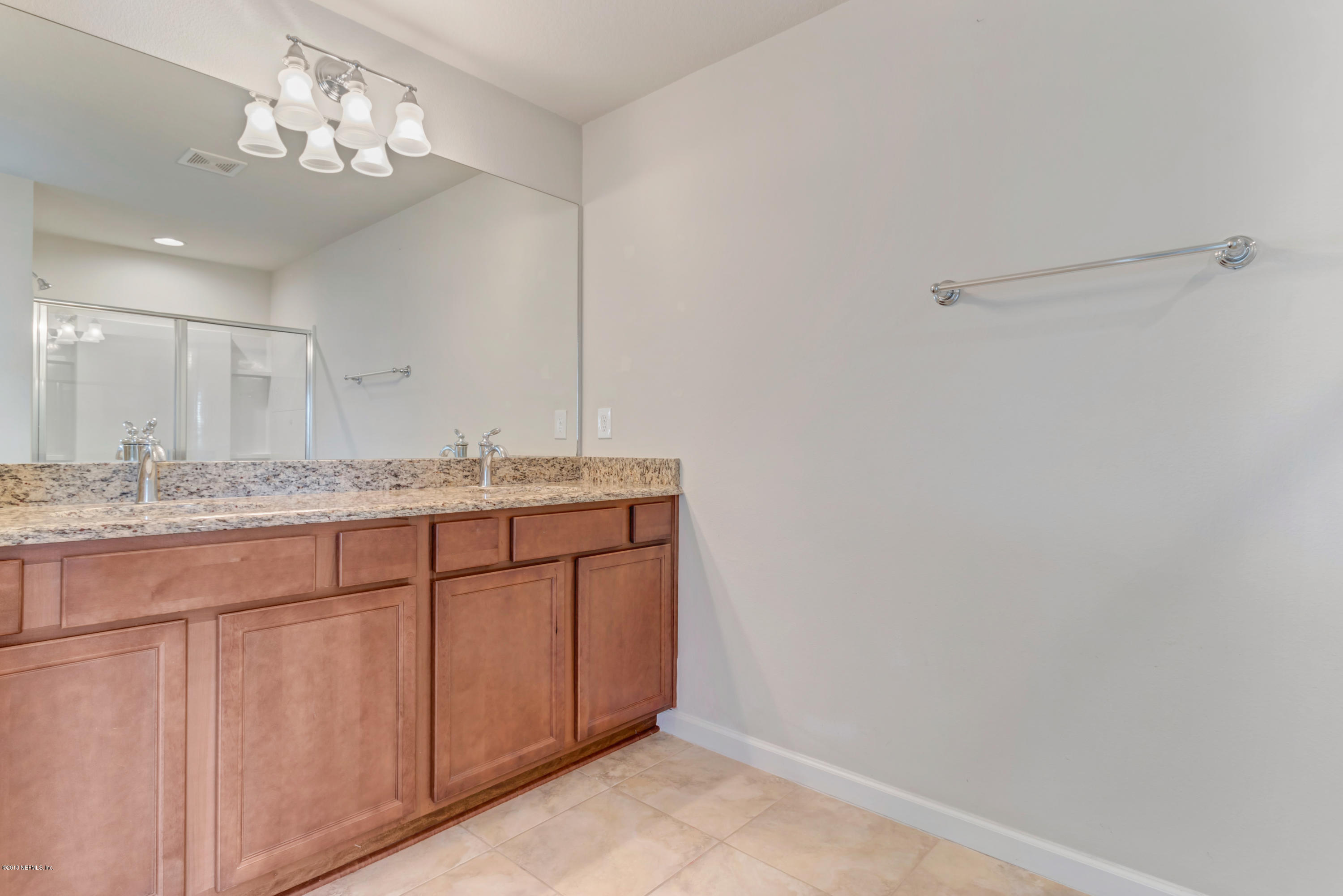 6798 Roundleaf Drive Jacksonville, FL 32258 - Photo 12 of 21 a bathroom with a sink and a mirror