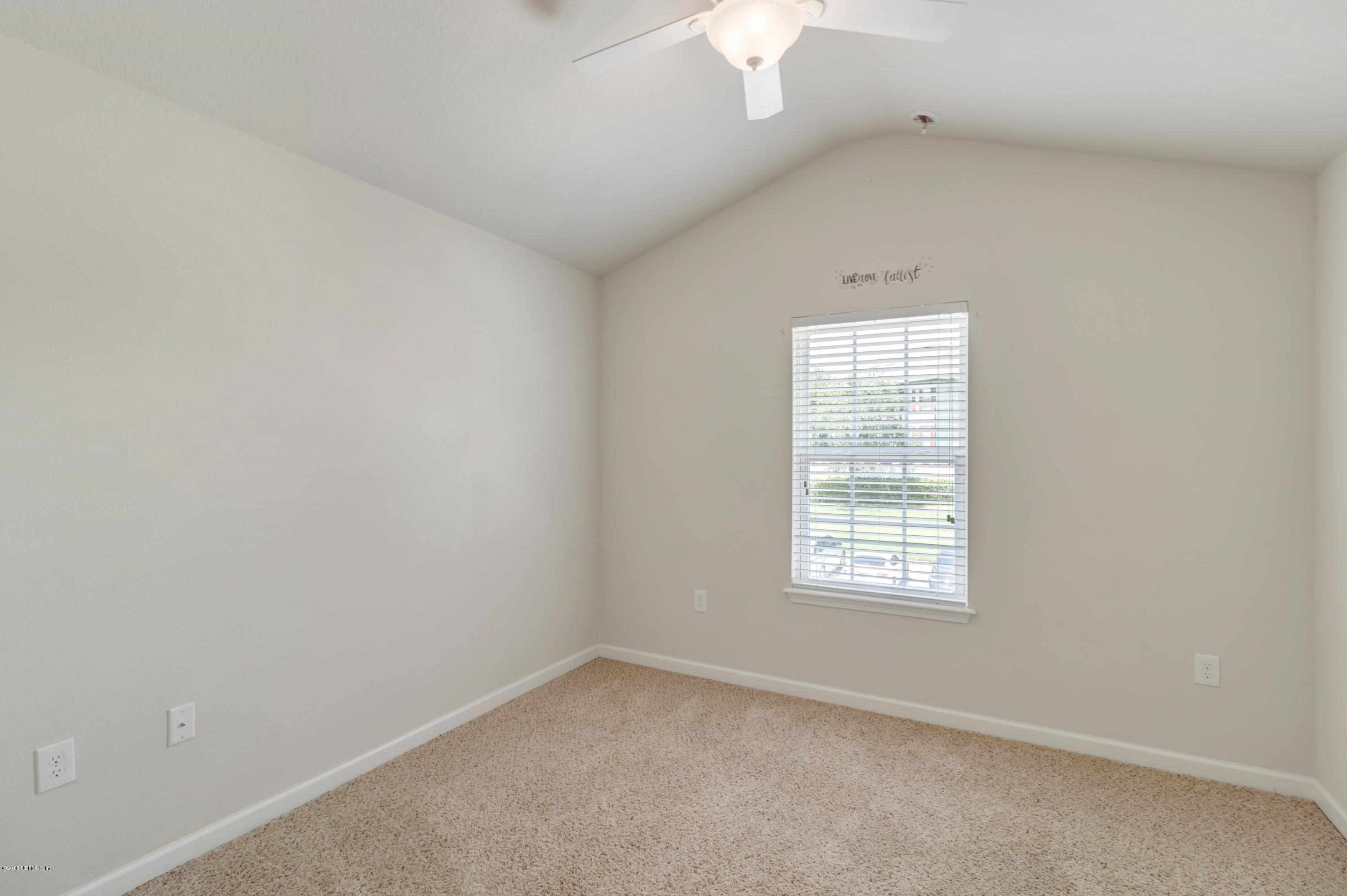 6798 Roundleaf Drive Jacksonville, FL 32258 - Photo 17 of 21 an empty room with a window