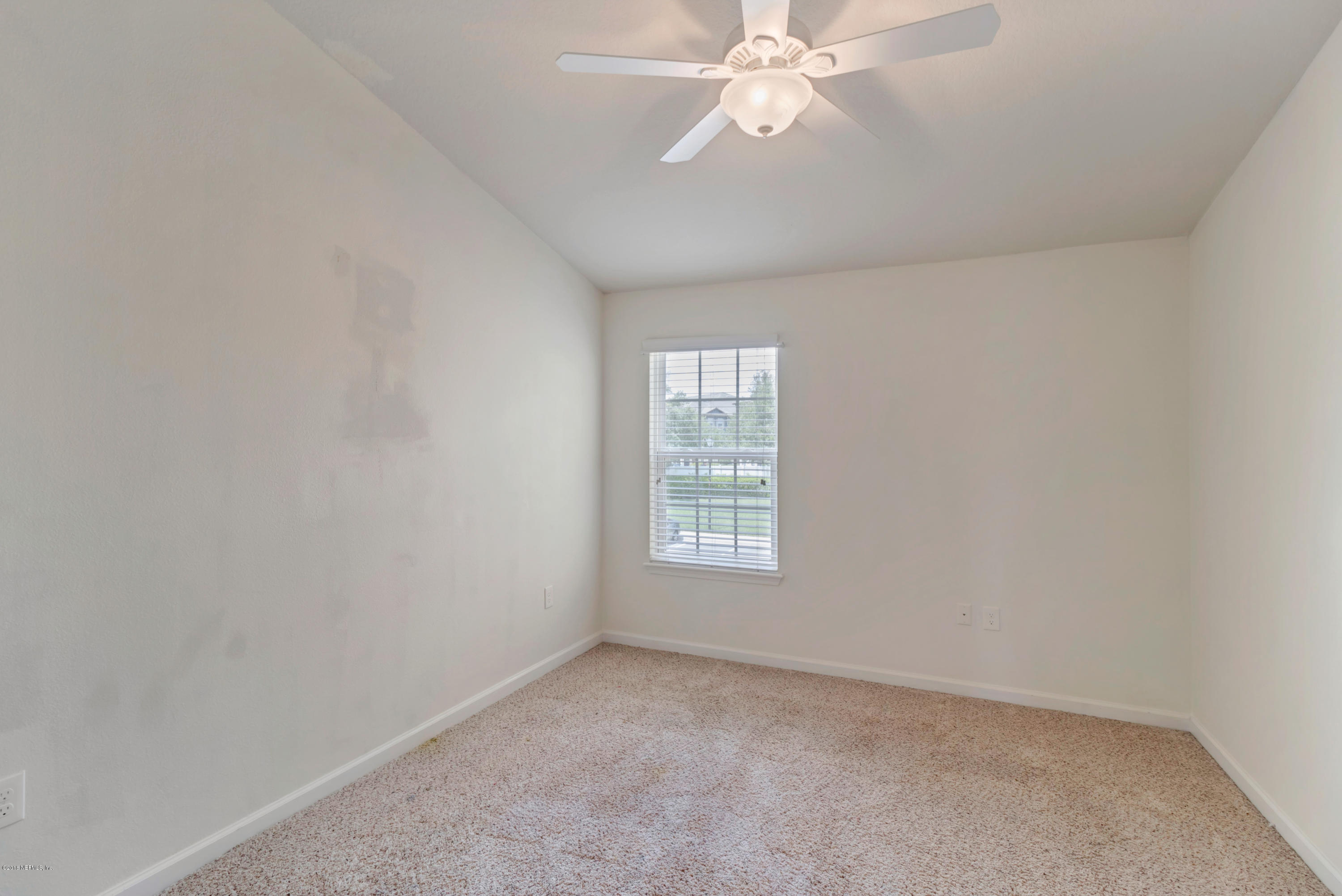 6798 Roundleaf Drive Jacksonville, FL 32258 - Photo 18 of 21 an empty room with a window
