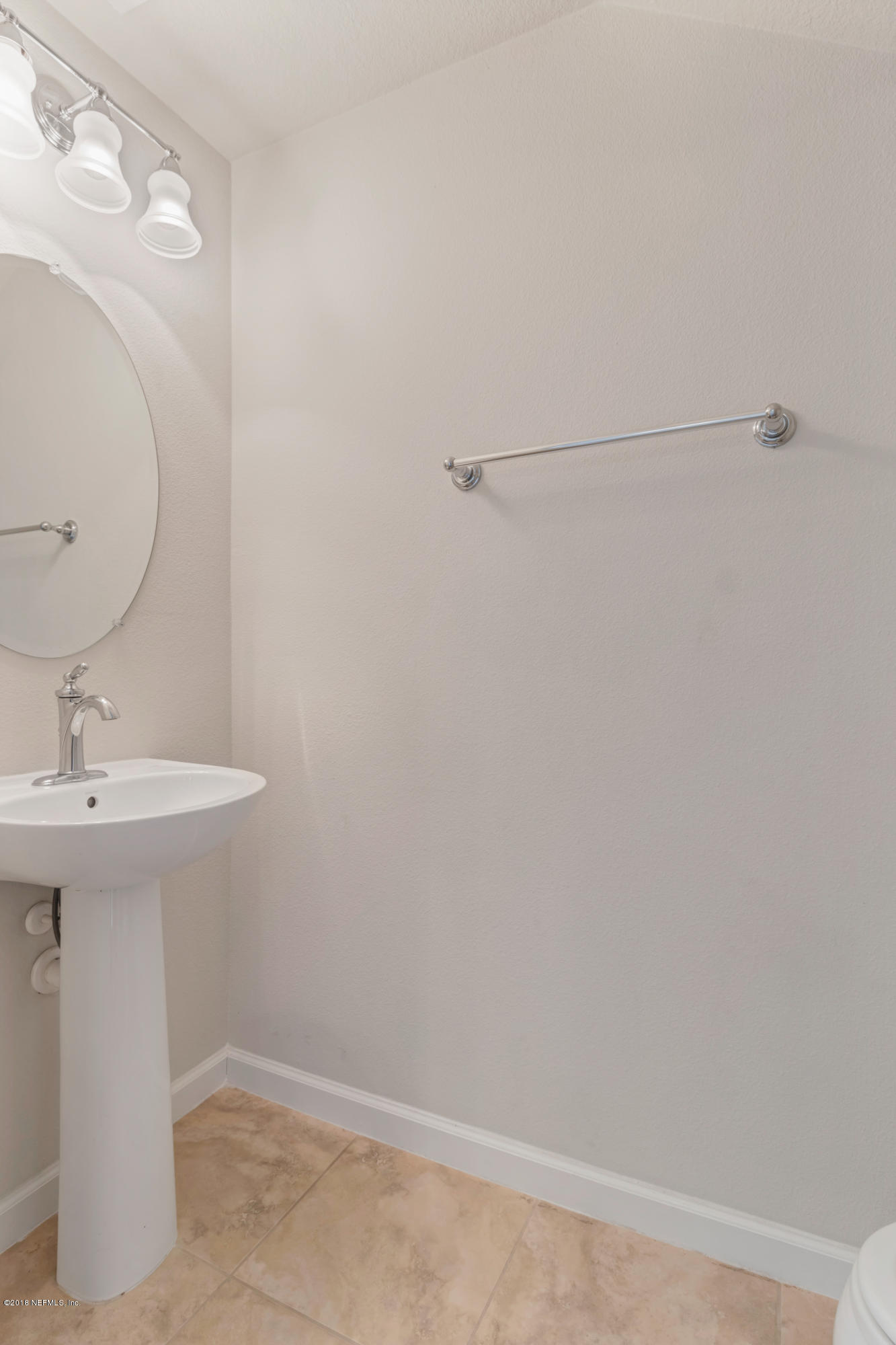 6798 Roundleaf Drive Jacksonville, FL 32258 - Photo 20 of 21 a bathroom with a sink and mirror