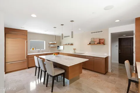 a living room with furniture a sink and appliances