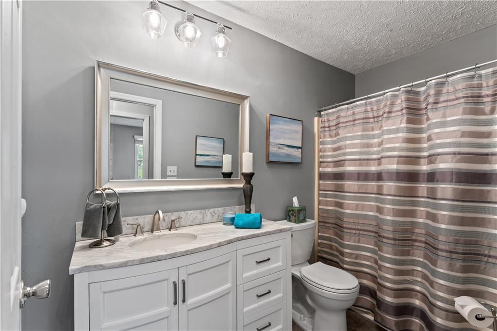763 Chapel Road Aliquippa, PA 15001 - Photo 13 of 26 Remodeled main bath shared by the two bedrooms!