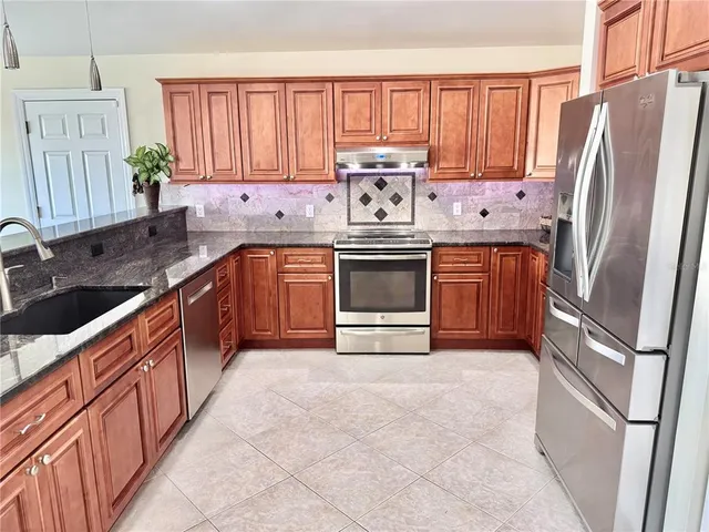 a bathroom with a toilet a sink and a shower