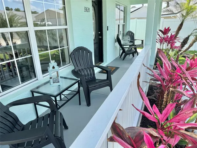 a front view of a house with patio outdoor seating