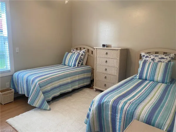 a bedroom with a bed and a cabinets