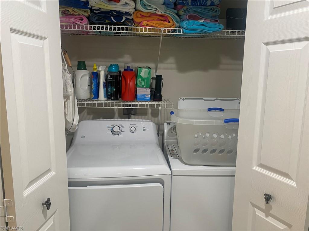 295 Waterside Circle, Unit 1102 Marco Island, FL 34145 - Photo 23 of 31 a utility room with dryer and washer