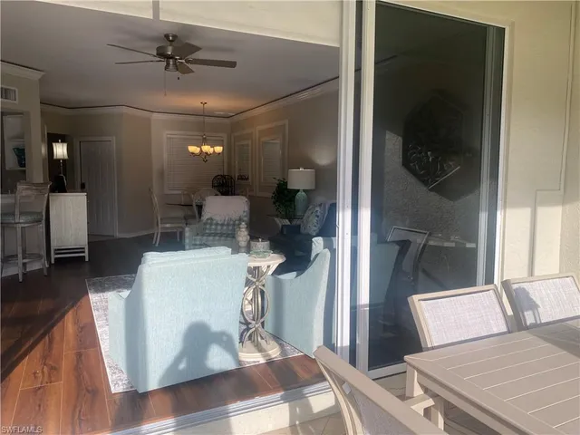 a view of a livingroom with furniture and window