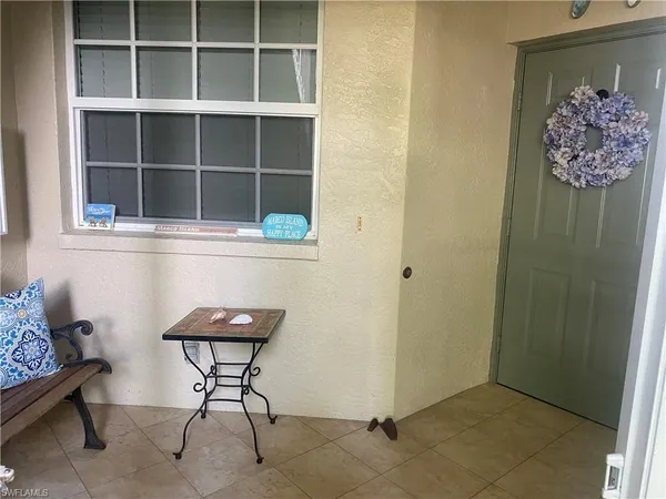 a view of workspace with wooden floor and cabinet