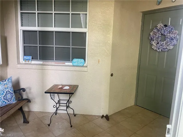 a view of workspace with wooden floor and cabinet